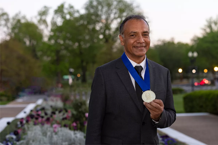 Photo of Shabir Madhi waering the Albert B. Sabin Gold Medal